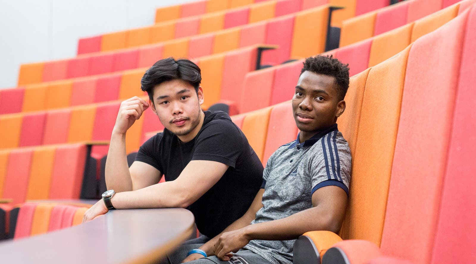Students sitting on lecture hall seats