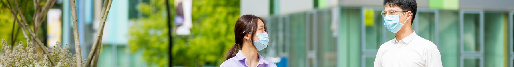 Students wearing face masks outside campus