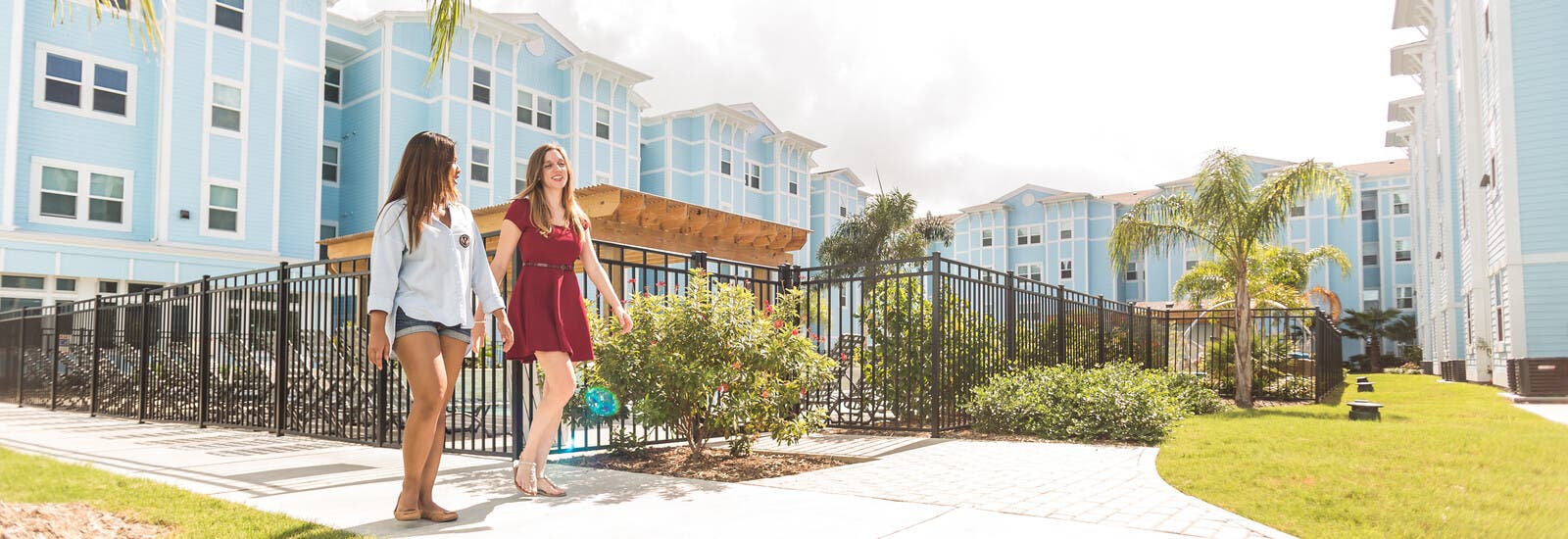 Students walking outside accommodation blocks