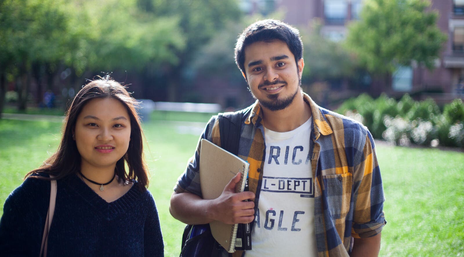 Students smiling outside campus
