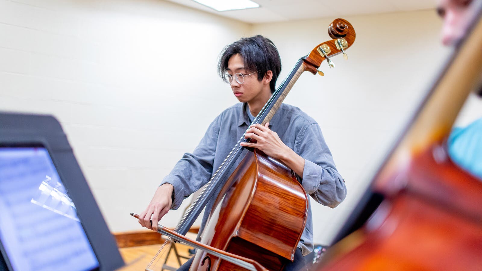 Student holding double bass