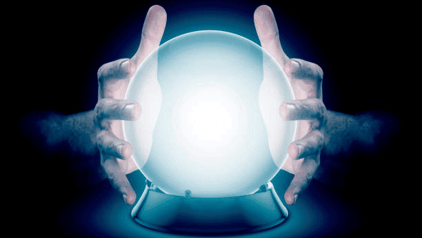 Hands touching crystal ball