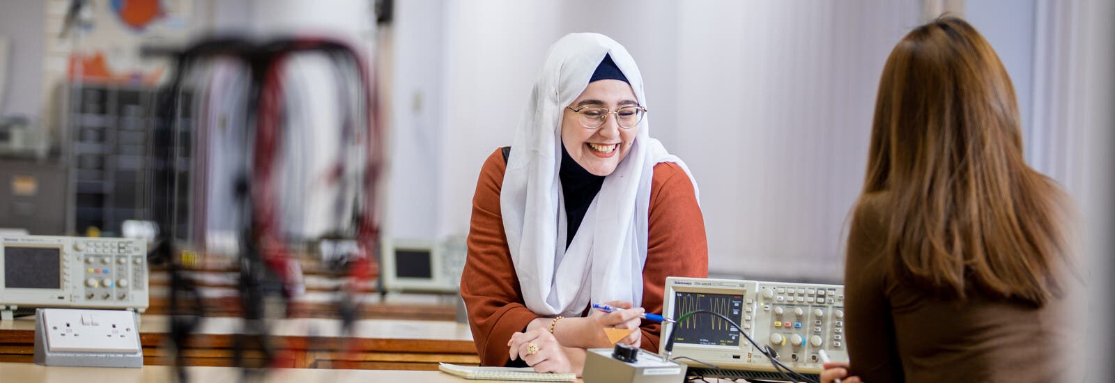 Two students working together in a lab