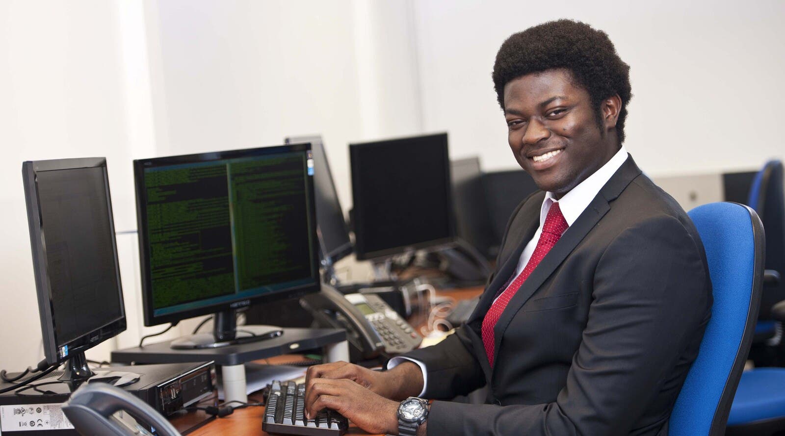 Student working at computer in an office