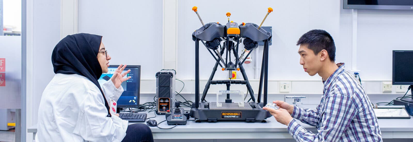 Engineering students working together in lab