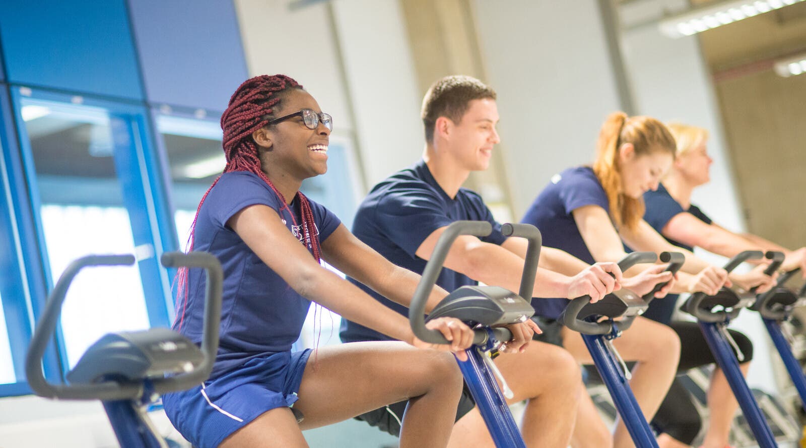 Sport science students on exercise bikes