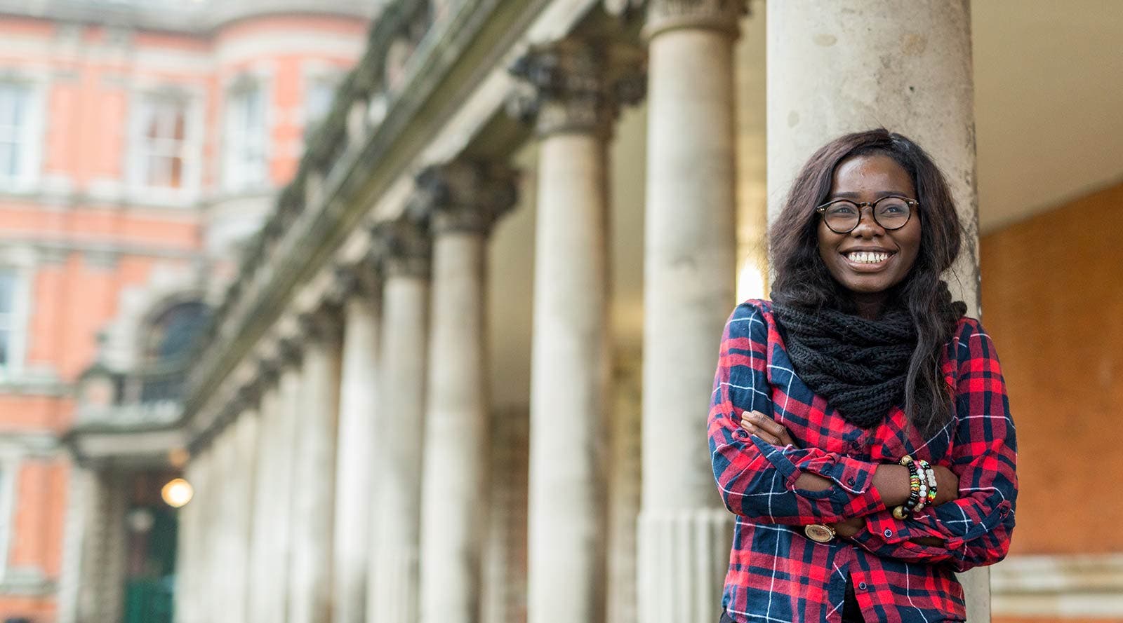 Christabel, an international student standing on RHUL campus