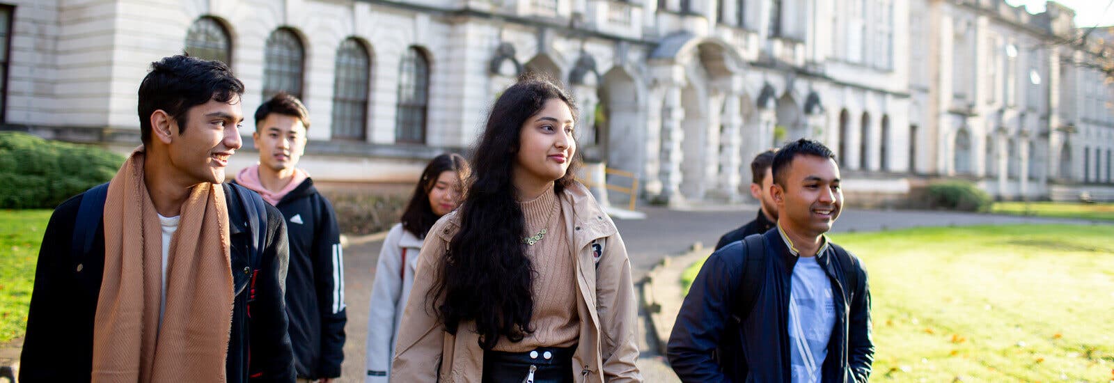 Cardiff University students walking through the campus