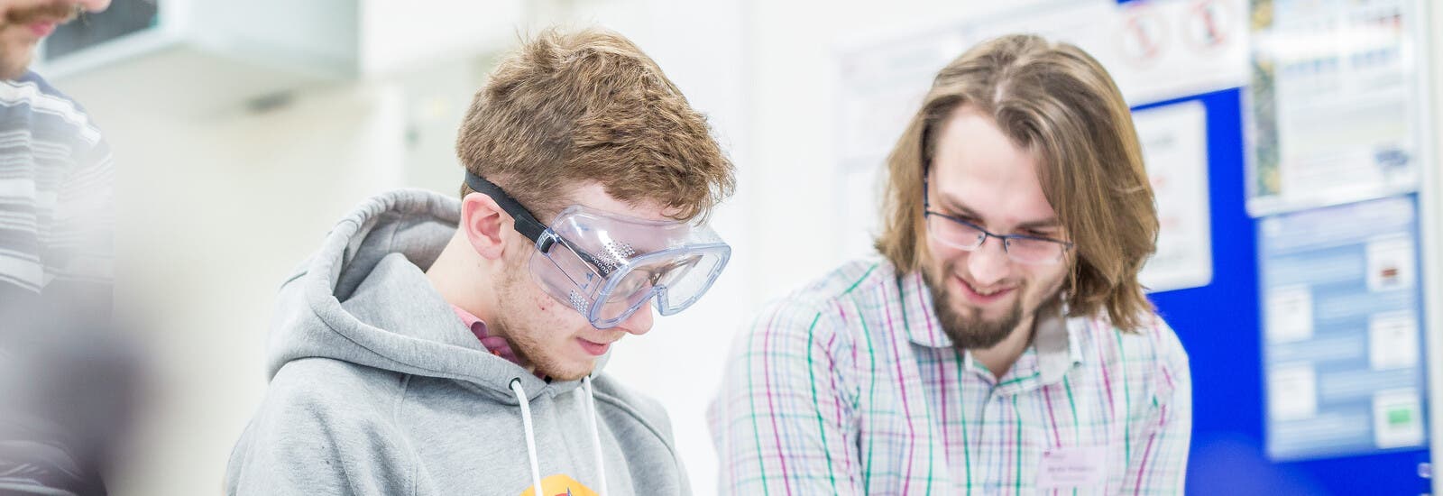 Science students in lab wearing goggles