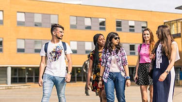 Surrey students walking on campus