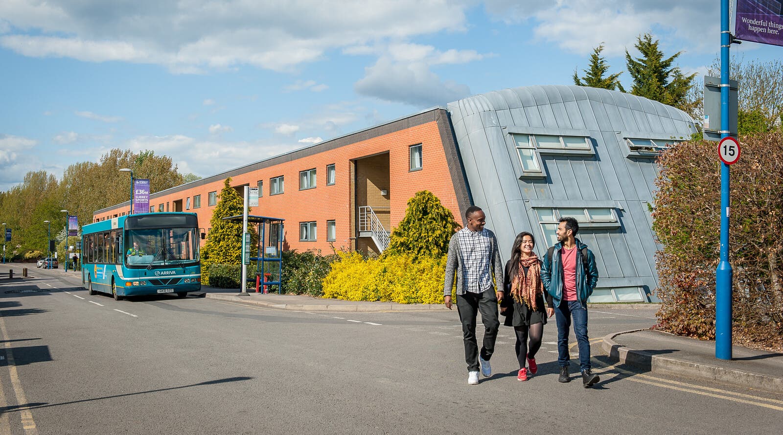 Surrey students walking together outside accommodation