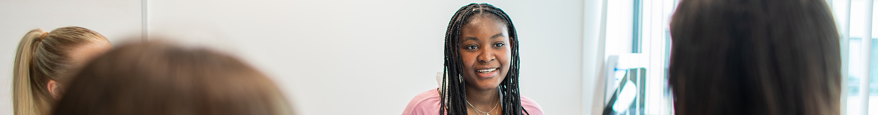 Student smiling at camera