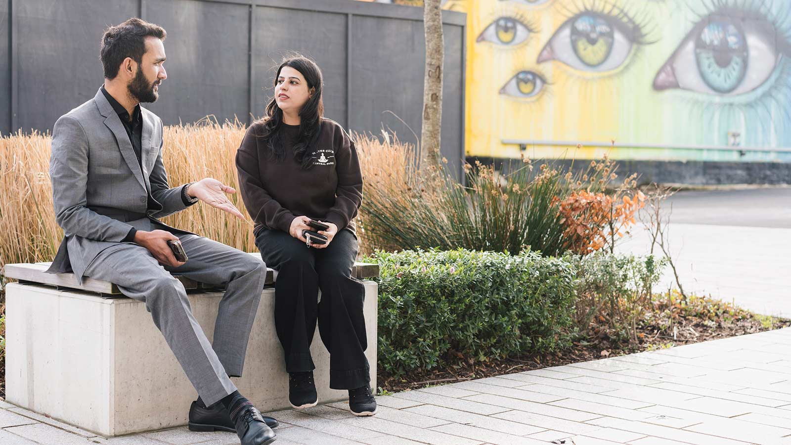 Two students talking on campus