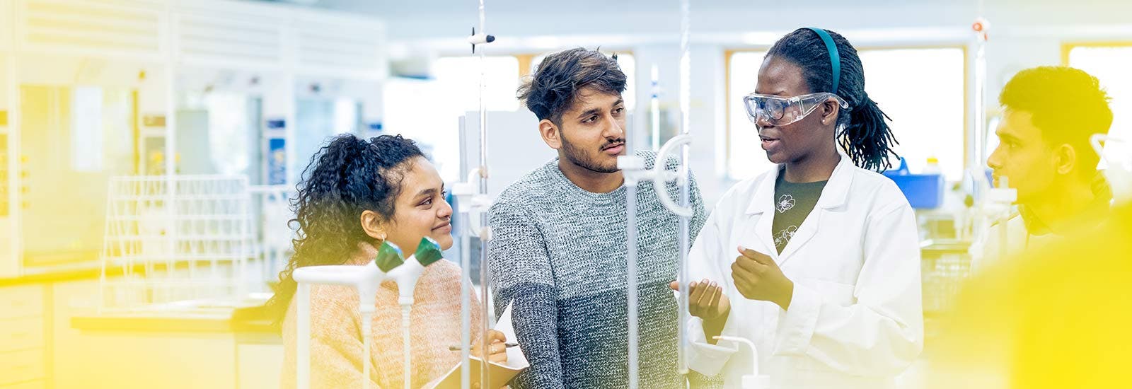 Four students in a science lab