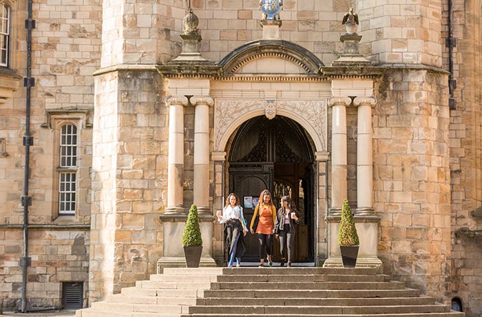 Students walking down stone steps