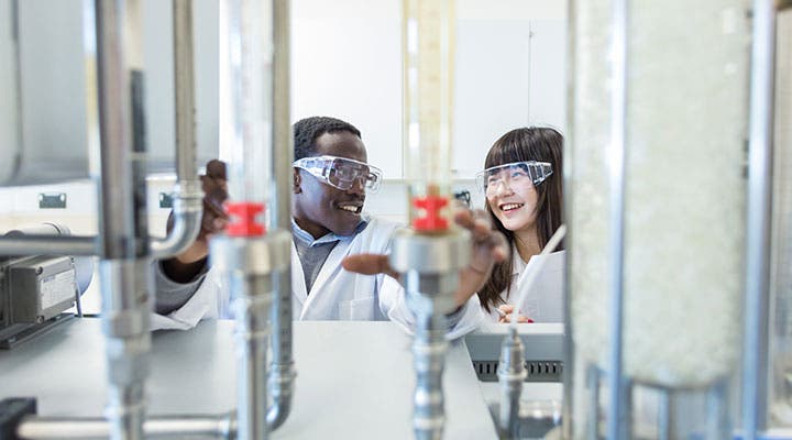 Students in lab wearing goggles