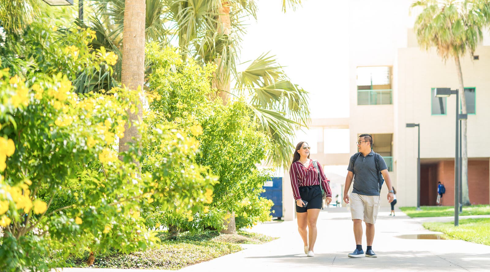 Two international students walking on campus at TAMU-CC.
