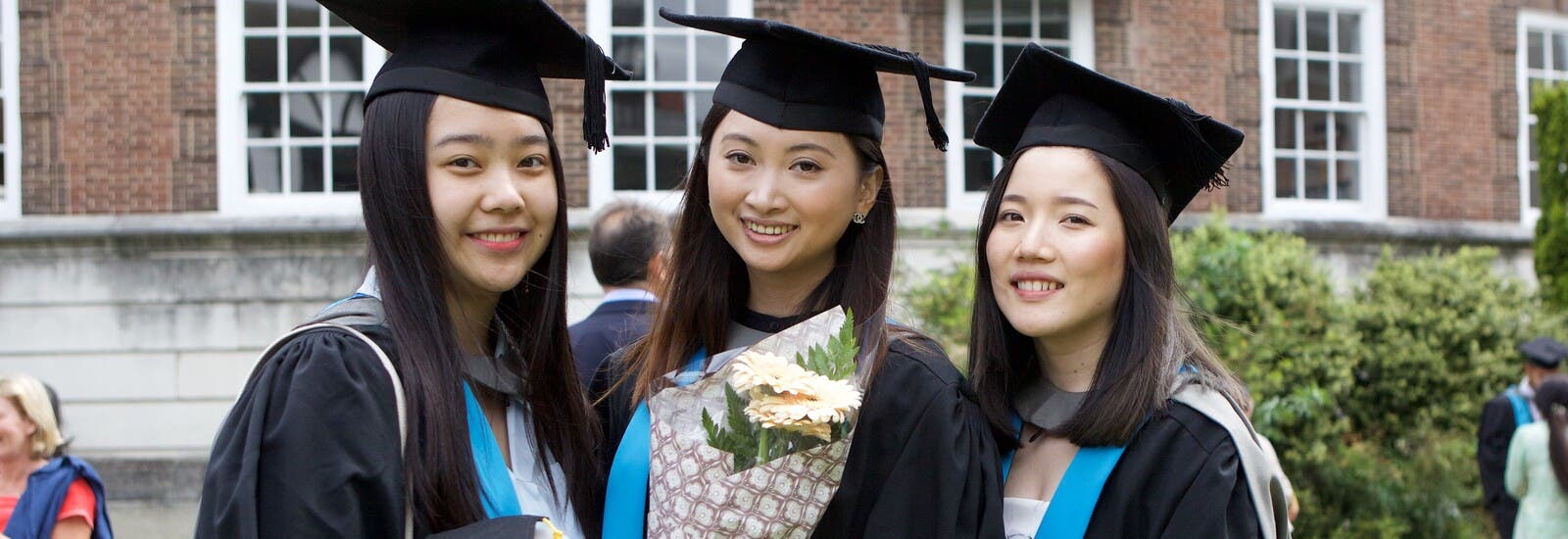Three students on their graduation day.