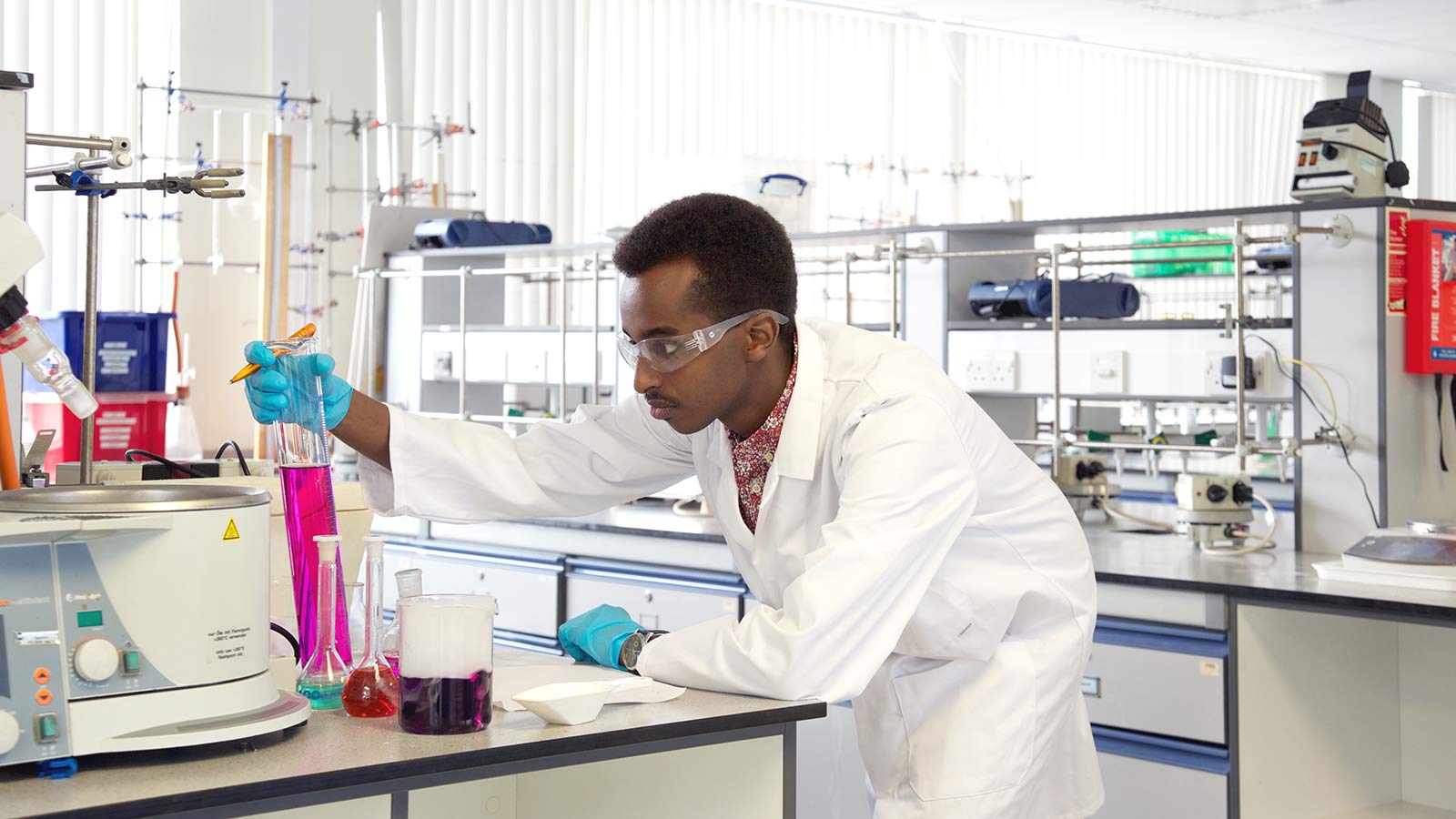 A University of Sussex student in a science lab