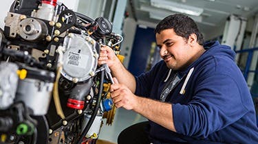 Huddersfield ISC student working on an engine