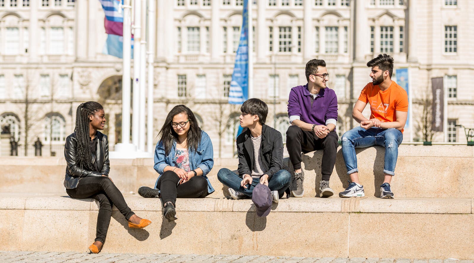 Five students on Liverpool's Royal Albert Dock.