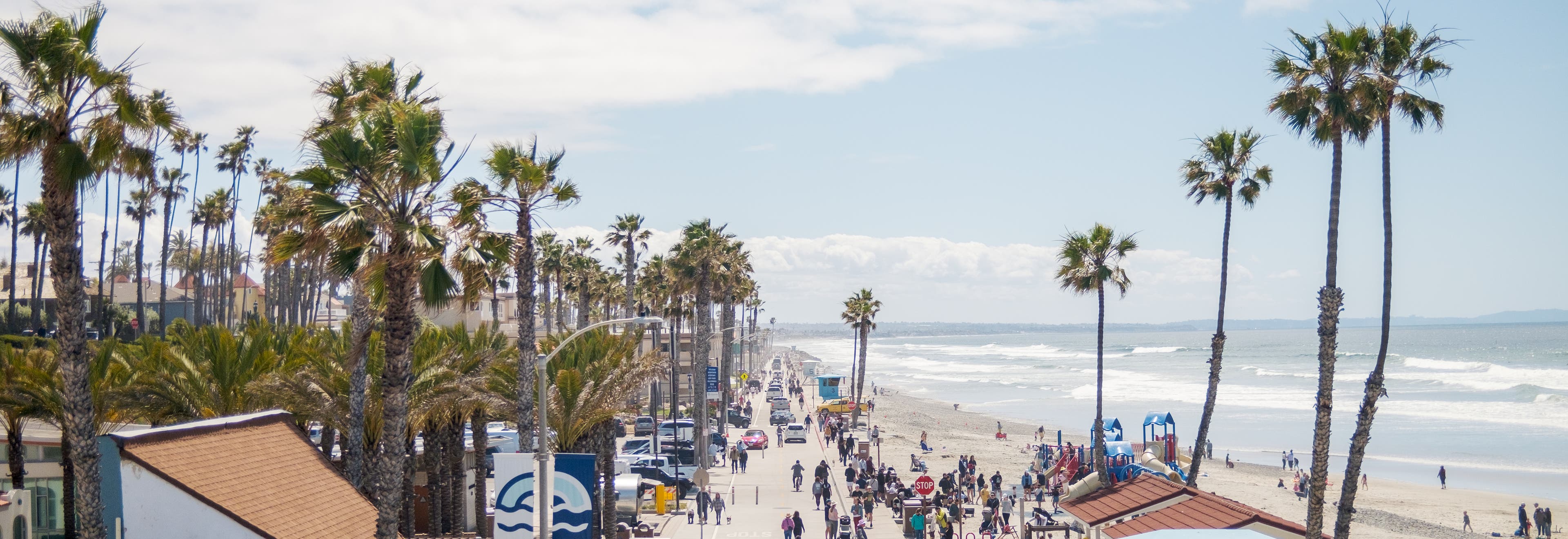 A wide shot of a beachside walkway