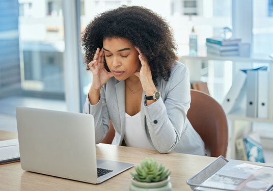 Woman stressed in her office