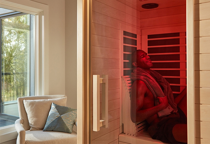 far infrared sauna with male sitting inside