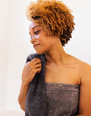 Woman with CELLIANT hand towel and wrap