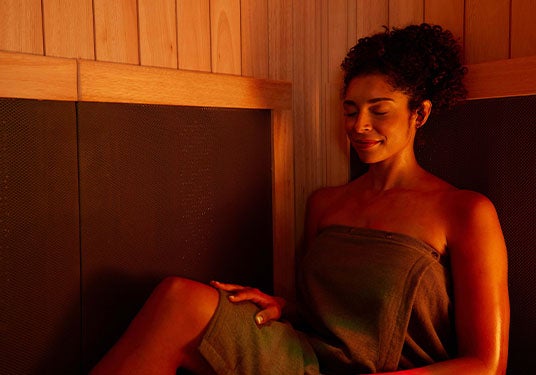 Woman relaxing in a Sunlighten sauna
