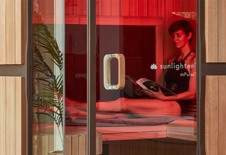 five person infrared sauna Woman reading and relaxing in sauna