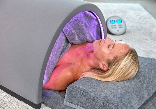 Woman sweating in a Sunlighten Solo System