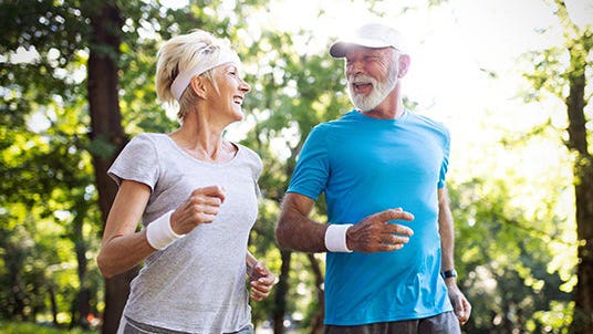 A couple running outdoors