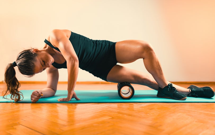 Woman using a foam roller 