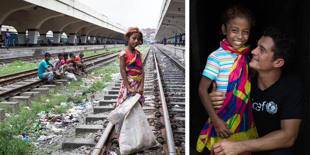 Dulaly, 10, stands with UNICEF Goodwill Ambassador Orlando Bloom in Kamalapur, Dhaka