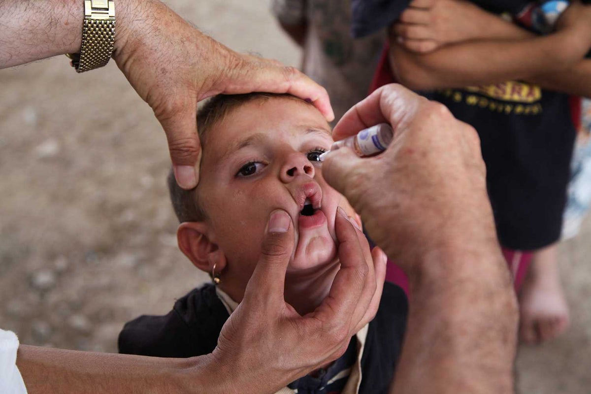 Boy receiving polio vaccine