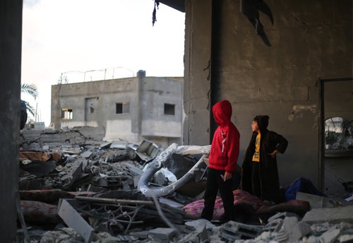 Palestinian children inspecting a house destroyed by an airstrike in Rafah city, during the ongoing hostilities in the Gaza Strip.