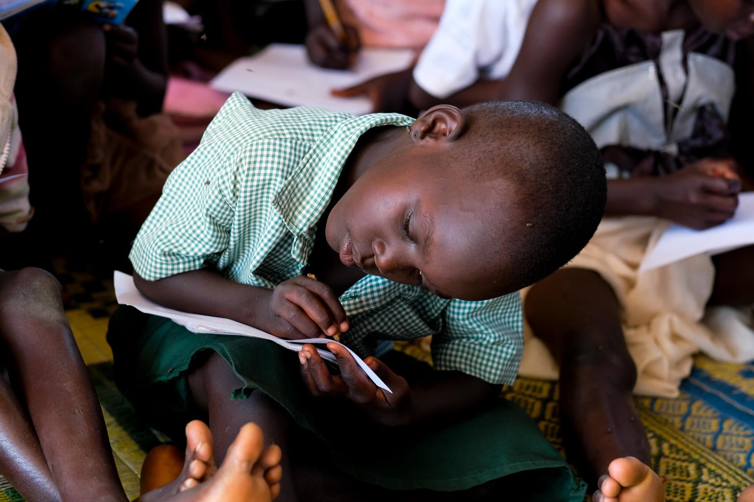 On 26 April 2018 in South Sudan, a student does classwork in Rock City Primary School in Juba, the capital.