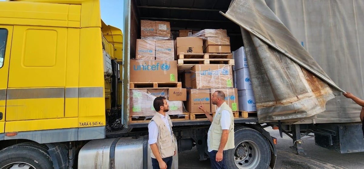 UNICEF staff deploying emergency supplies from a warehouse in Libya. 