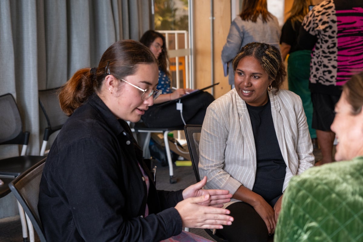 A group of young women have a discussion during an exercise at the 2025 Dialogue.