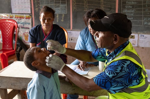 A child receives immunisation