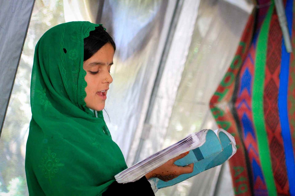 Child reads from book