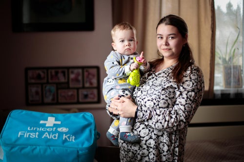 A woman holding her child