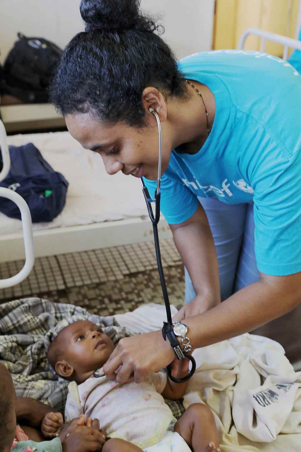 UNICEF health officer Dr Philomena Tatireta checks on the health of children in the hospital. 