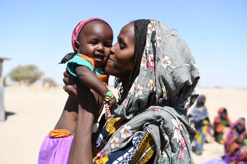 At a displacement camp in Chad, a mother holds her baby.