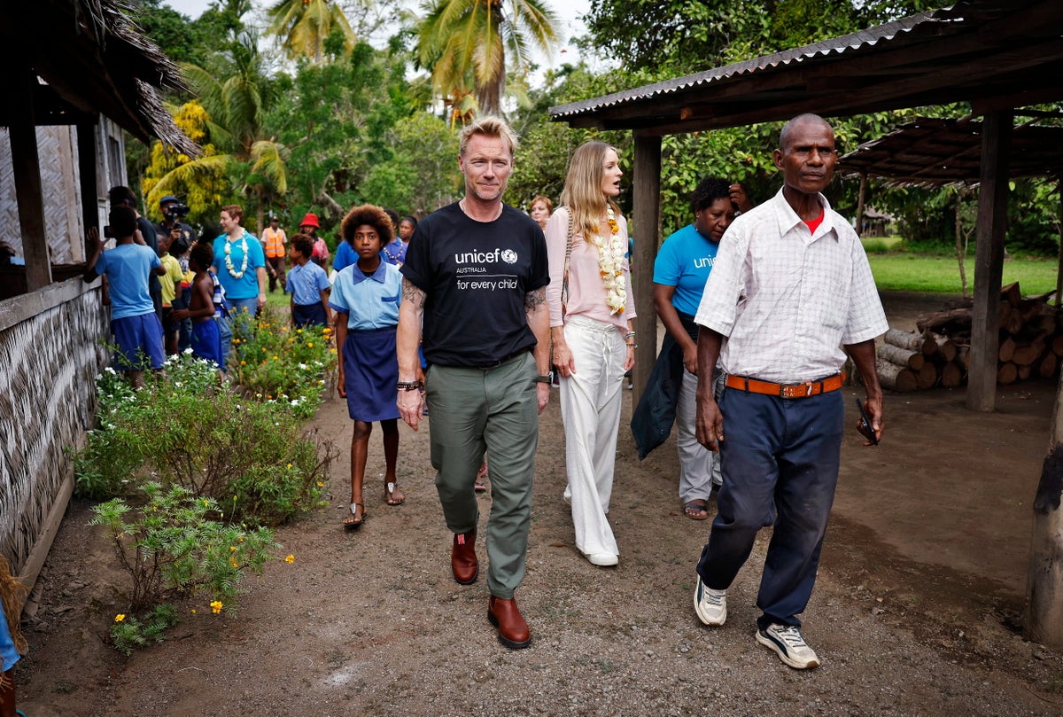 Ronan and Storm are shown the WASH facilities UNICEF and partners have built