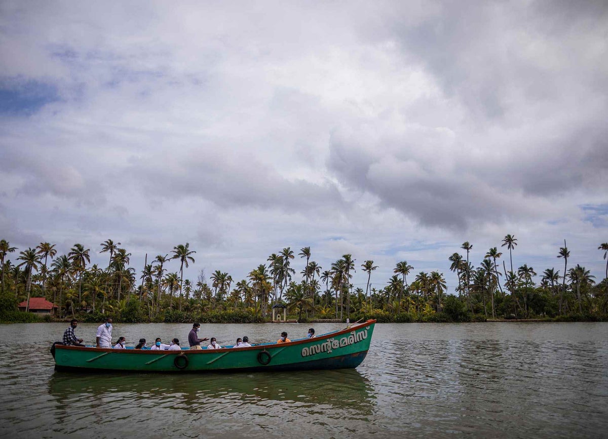 Dr. Aneesh travels by boat with his team to reach Munroe Island for COVID-19 vaccinations
