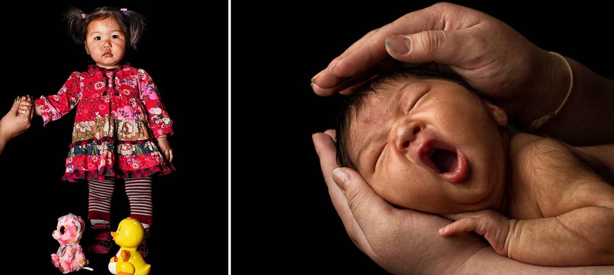 Uuriintsolmon, 1, holds the hand of her mother, Bayarmaa, 31, as she stands for a portrait in Khövsgöl Province, Mongolia