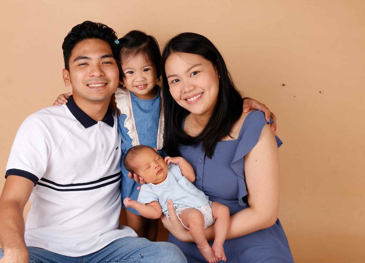 Dennis with his wife, newborn son and daughter prior to leaving the Philippines.  