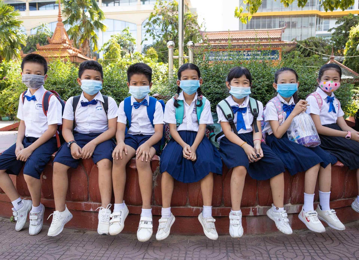 Students wear masks at a primary school in Phnom Penh, Cambodia during their second day of school re-opening.